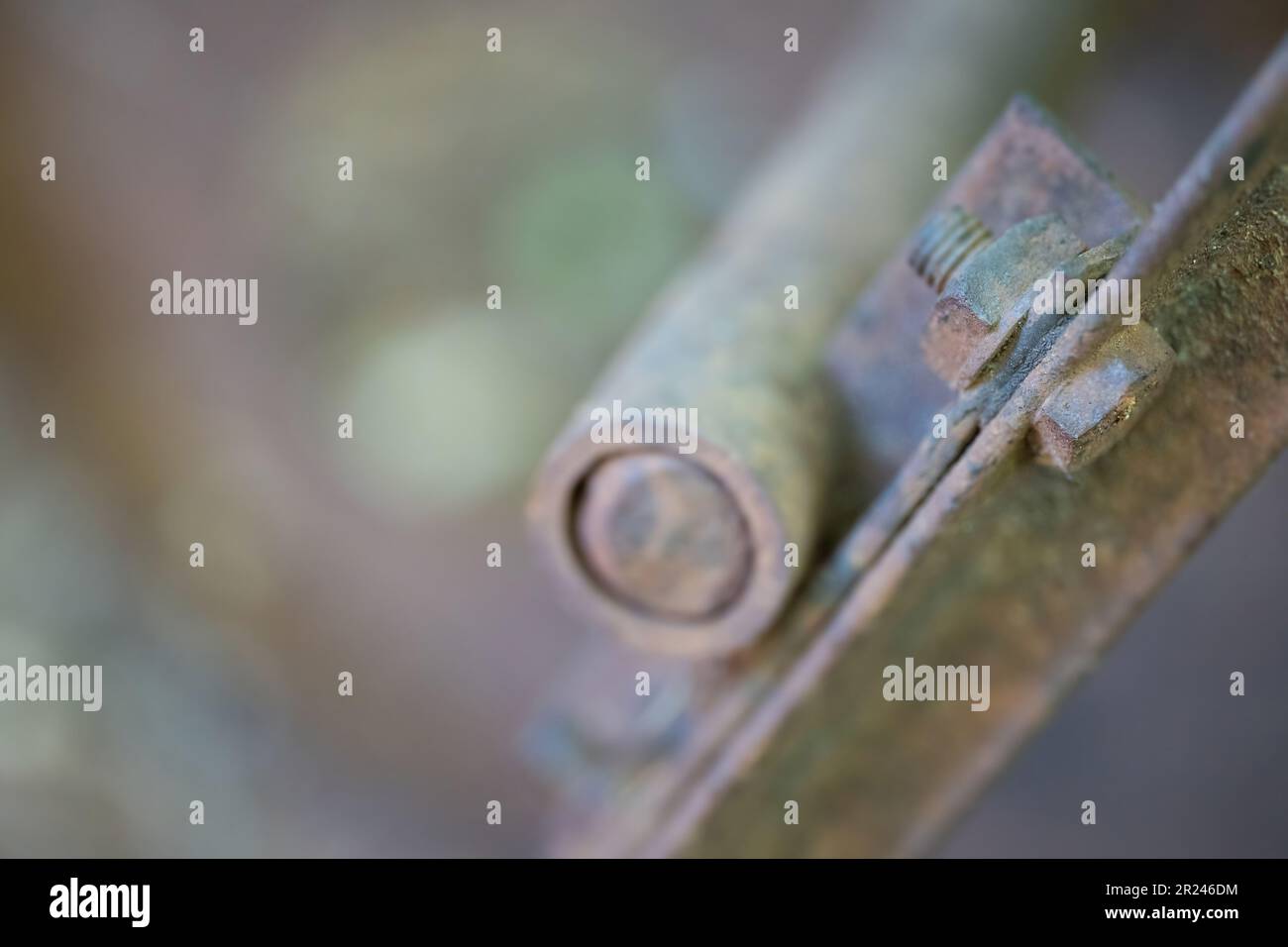 Close up of an old rusty screw. Selective focus. Abstract view. Pastel colors. Stock Photo