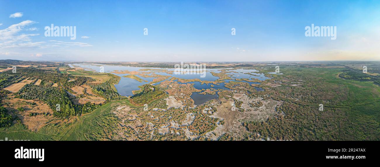 Panorama view of the lake Velence in Hungary. Lake Velence is the third largest lake in Hungary. One-third of its surface is covered by reed. Stock Photo