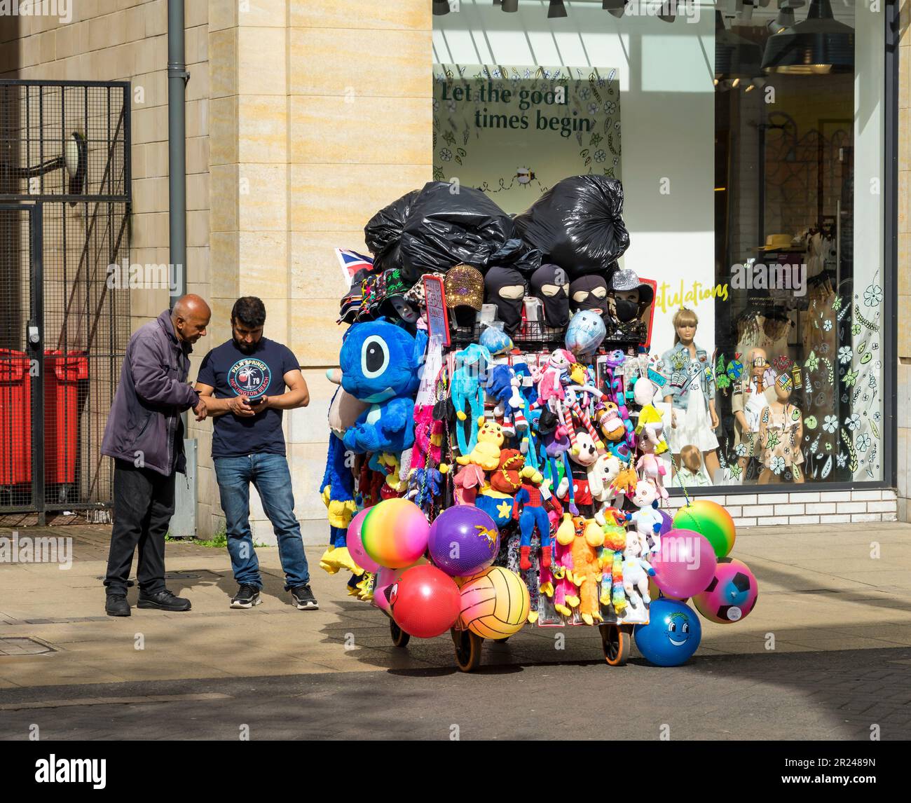 Street sellers goods on trolley High Street Lincoln city, Lincolnshire