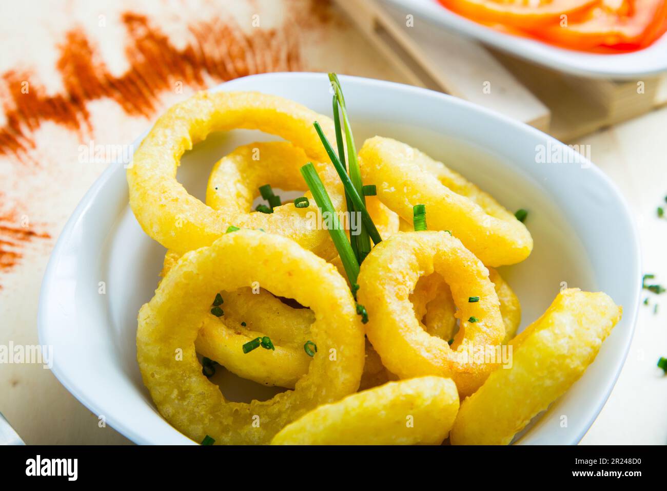 Spanish tapa of squid rings Roman style. Stock Photo