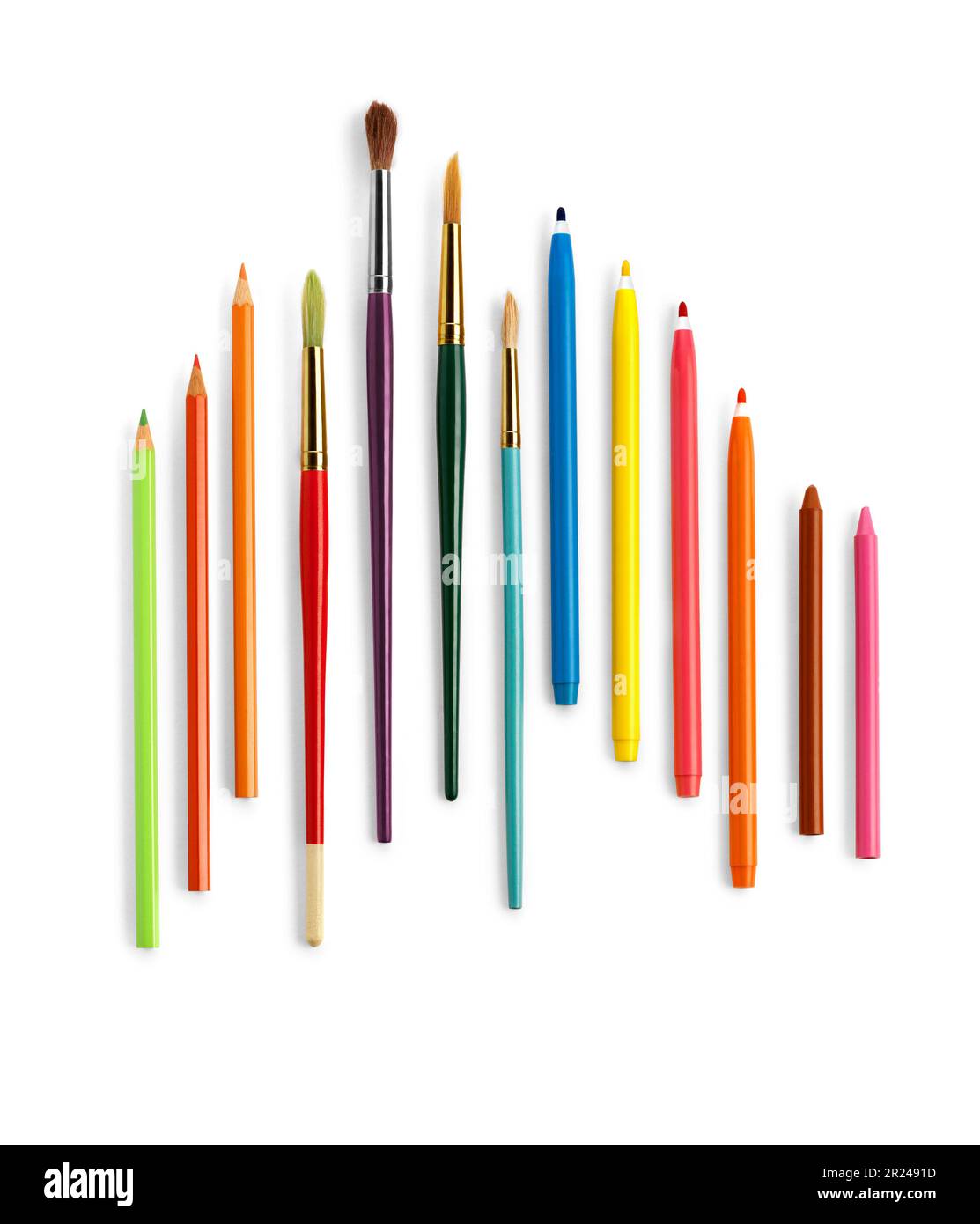 Set of pencils brushes and colorful crayons against white background. Clipping path Stock Photo