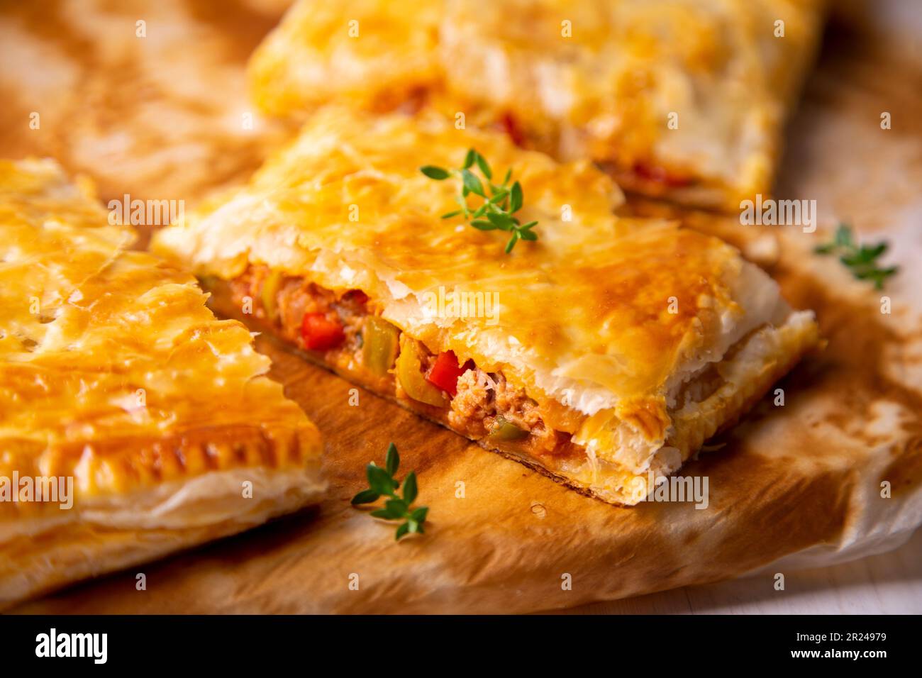 Galician puff pastry empanada stuffed with tuna and vegetables Stock