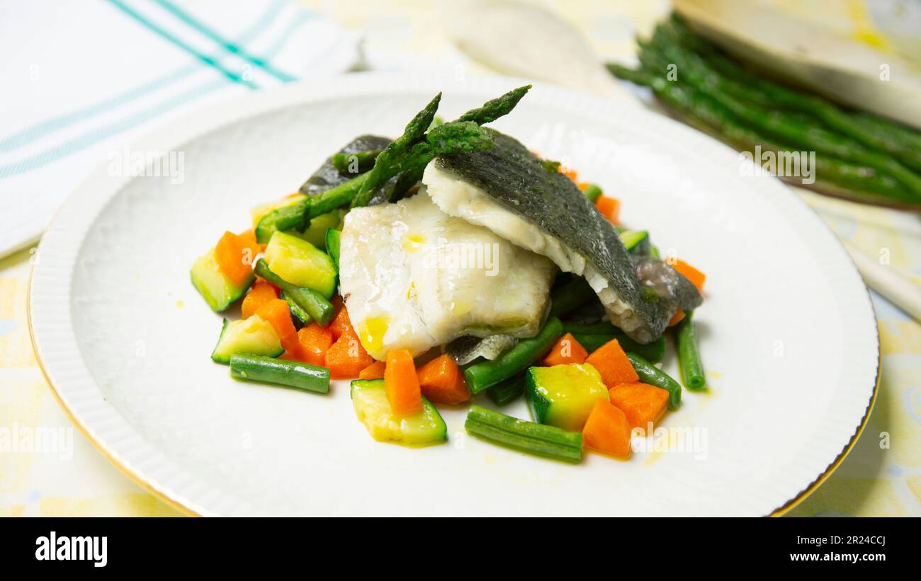 Premium turbot dish cooked in the oven with vegetables in a luxury restaurant. Stock Photo