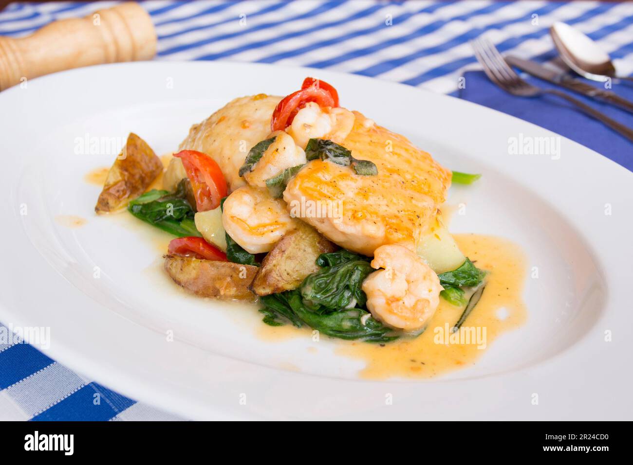 Premium monkfish dish cooked in the oven with vegetables in a luxury restaurant. Stock Photo