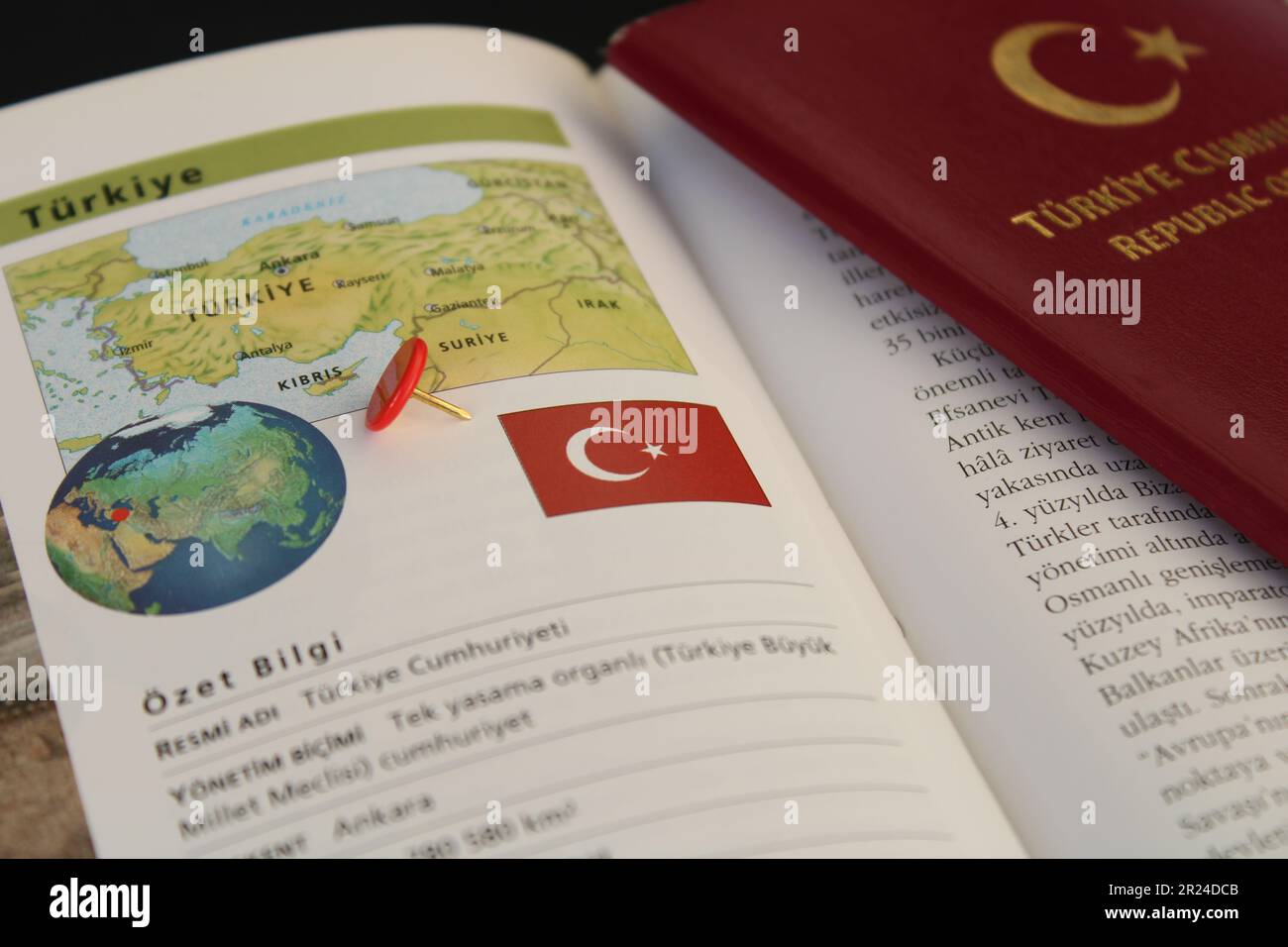 A book with a turkish passport and a turkey flag on it. Turkish map and ...