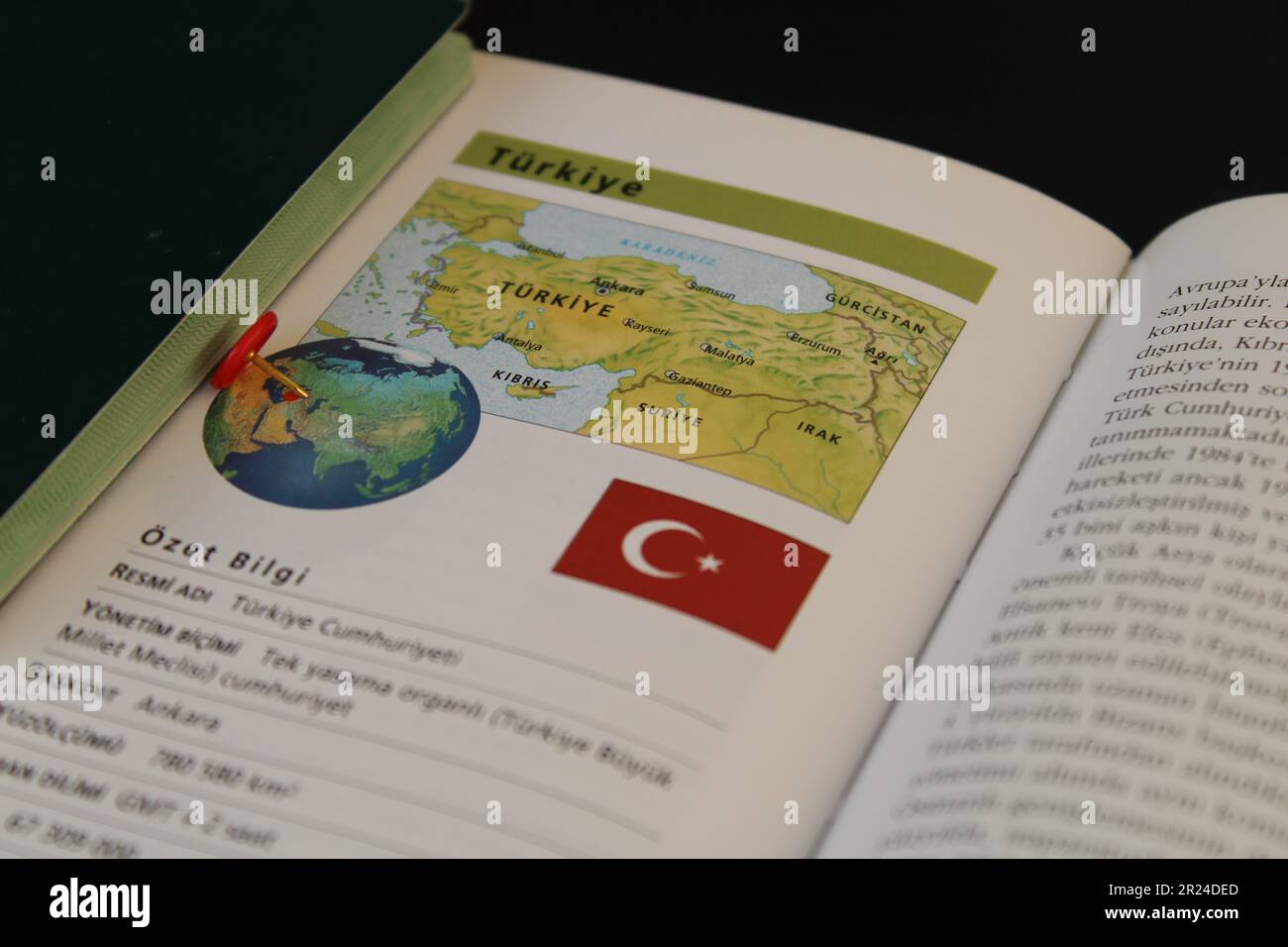A book with a turkish passport and a turkey flag on it. Turkish map and ...
