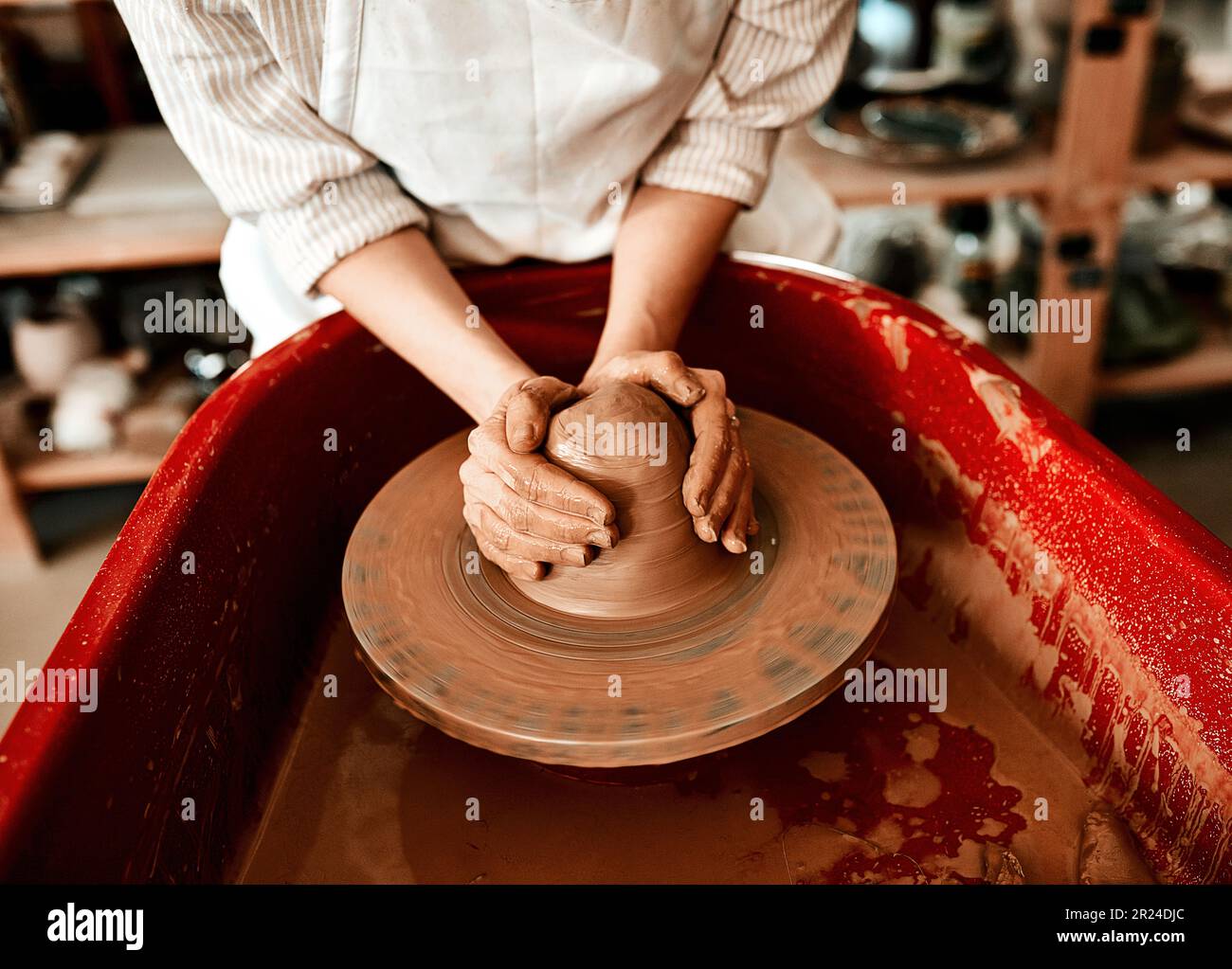 I dont mind getting my hands dirty. an unrecognizable woman molding clay on  a pottery wheel Stock Photo - Alamy