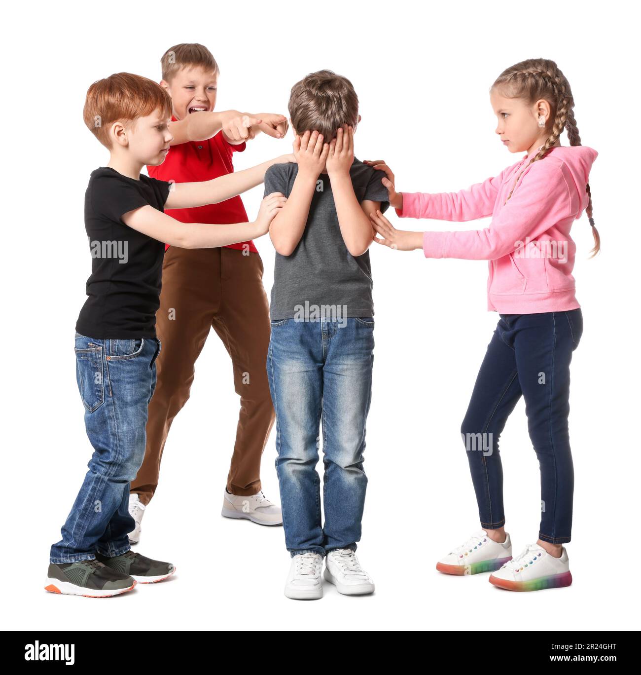 Kids bullying upset boy on white background Stock Photo