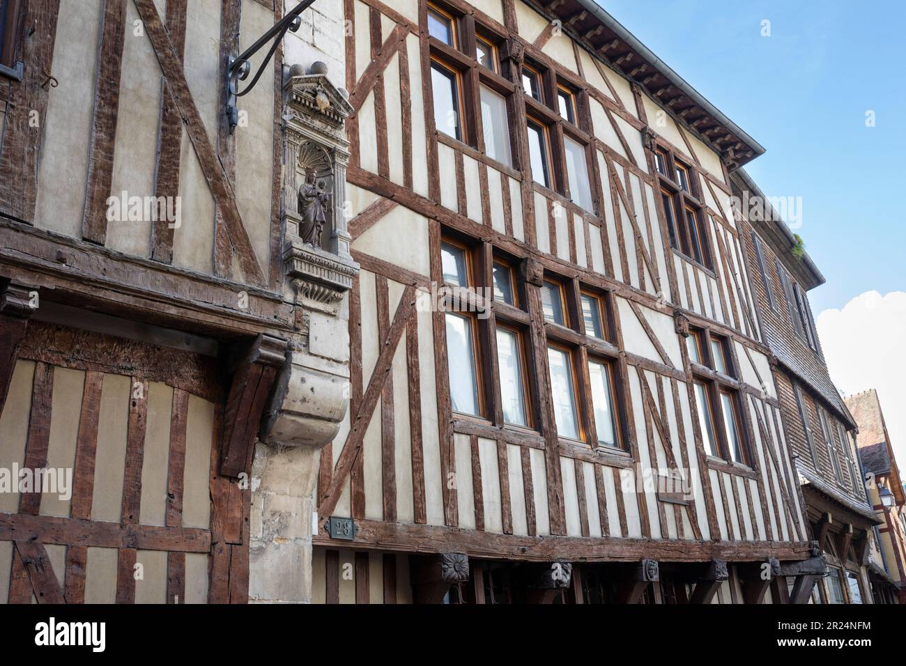 Half-timbered house with a shrine with Mary and Jesus in the city center of Troyes, France Stock Photo