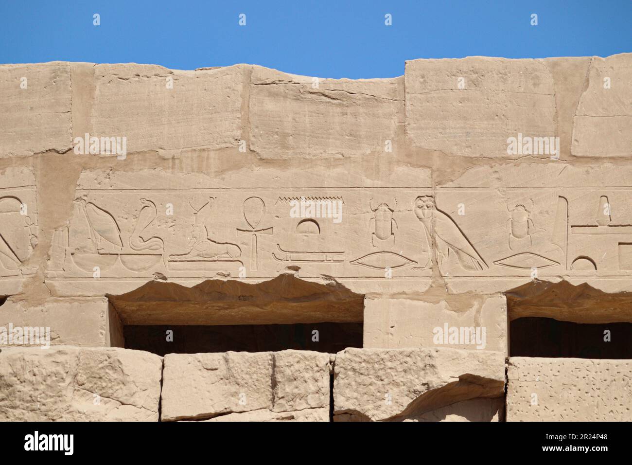 Ancient egyptian hieroglyphs carved on walls of Karnak temple in Luxor ...