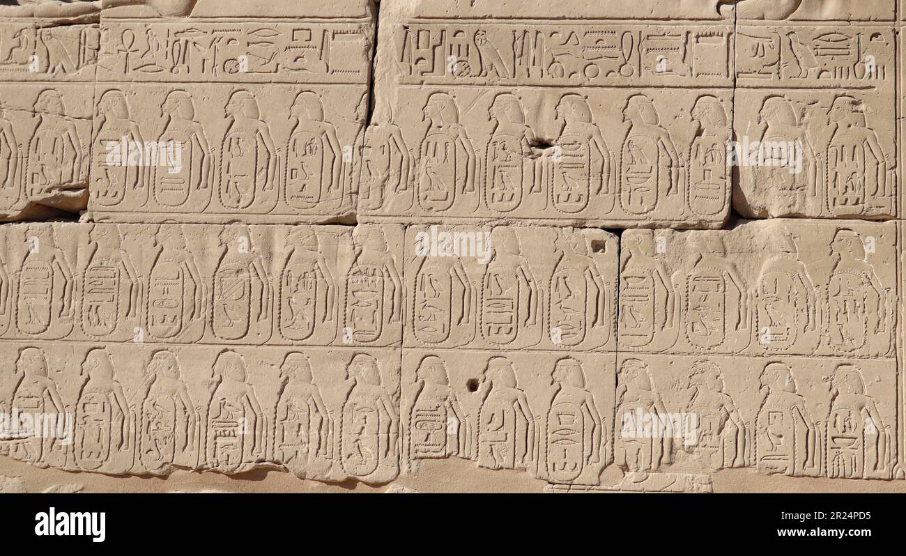 Ancient egyptian hieroglyphs carved on walls of Karnak temple in Luxor ...