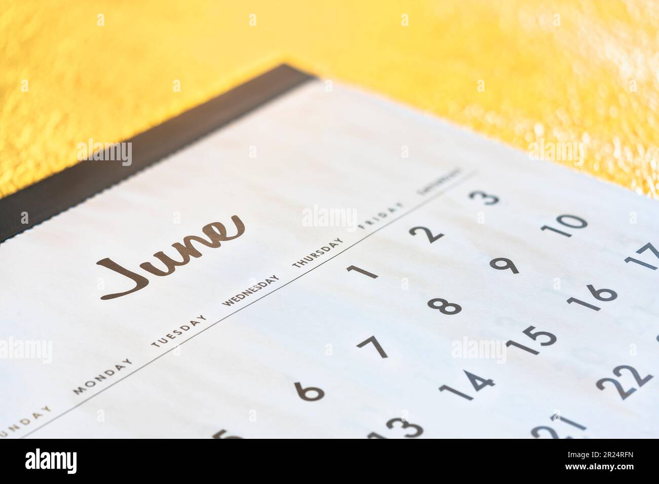 Close up of a simple calendar showing the month of June page with days ...