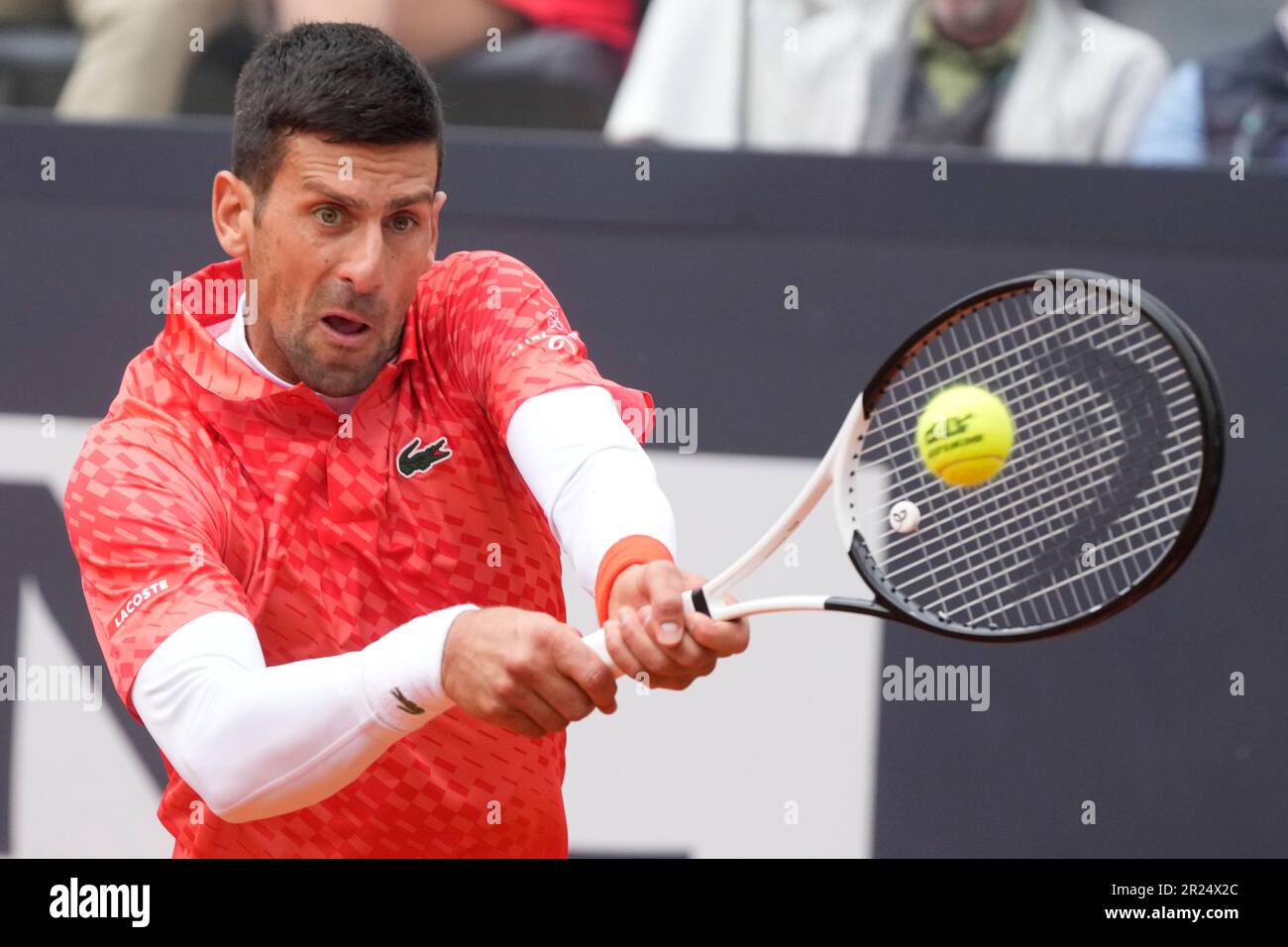 Serbias Novak Djokovic returns the ball to Denmarks Holger Rune during their quarter final match at the Italian Open tennis tournament, in Rome, Wednesday, May 17, 2023