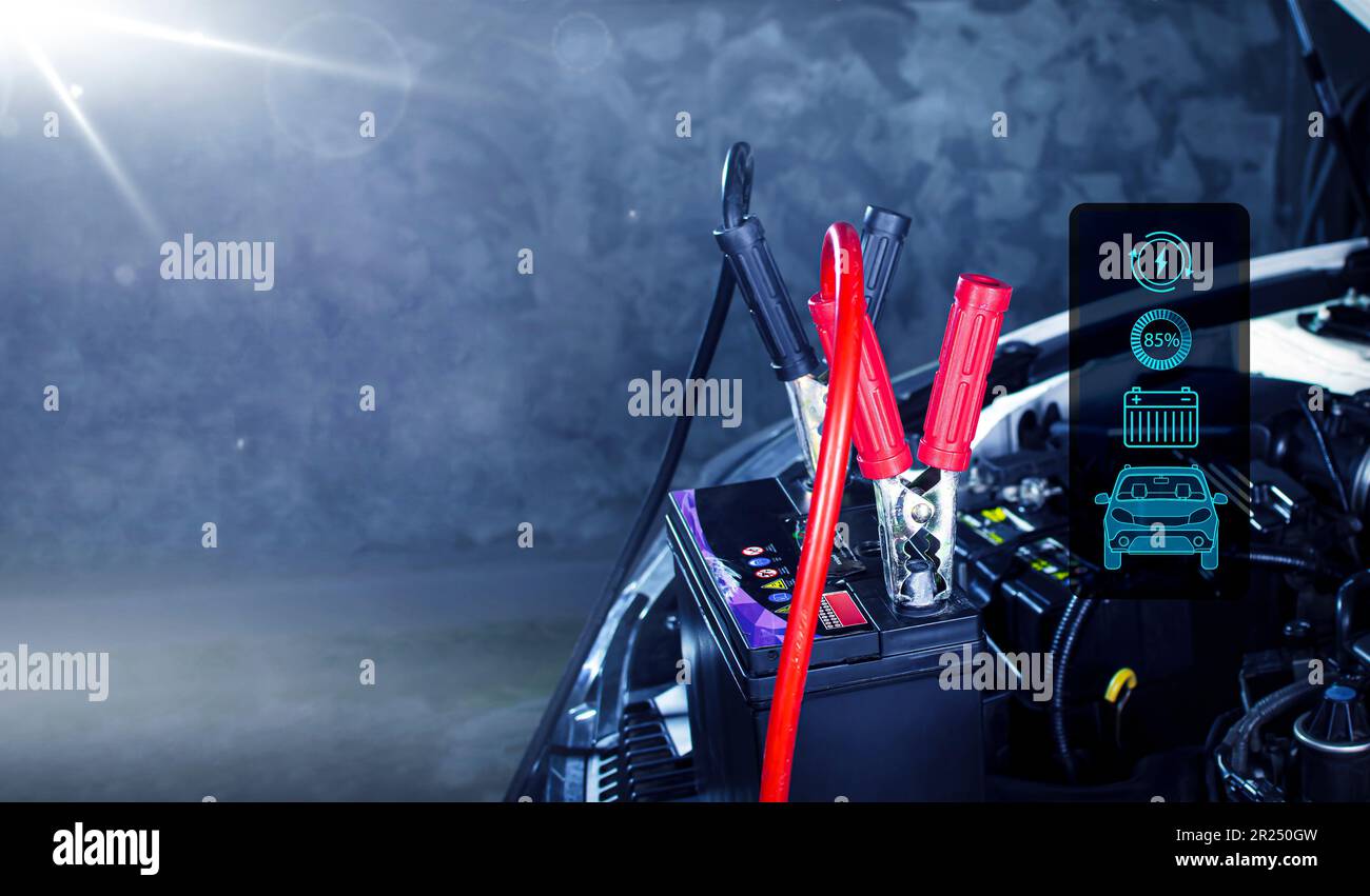 Car battery charging in the auto repair garage with copy space