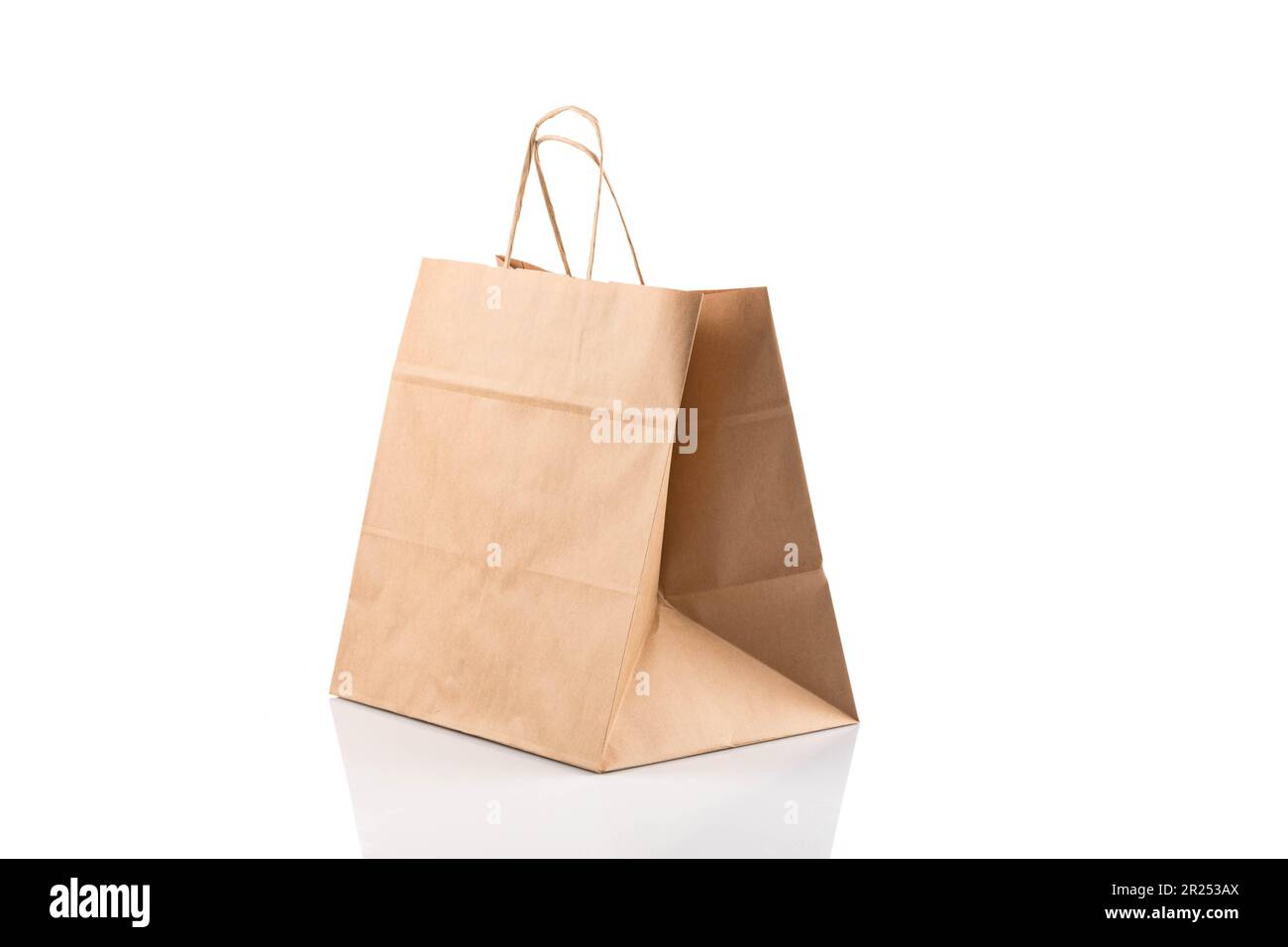 Recycled paper kraft shopping bag. This package bag isolated on white