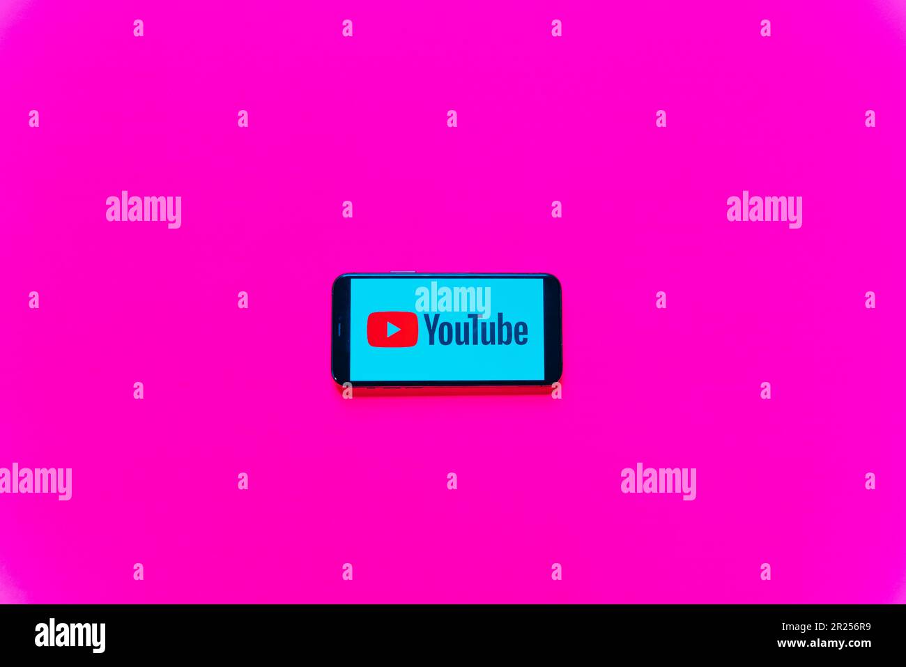 phone screen with youtube logo in pink background. Calgary, Canada. High quality photo Stock Photo