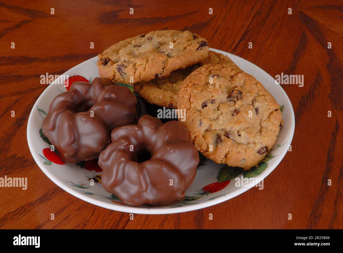 Plate of horribly fattening chocolate and raisin cookies Stock Photo