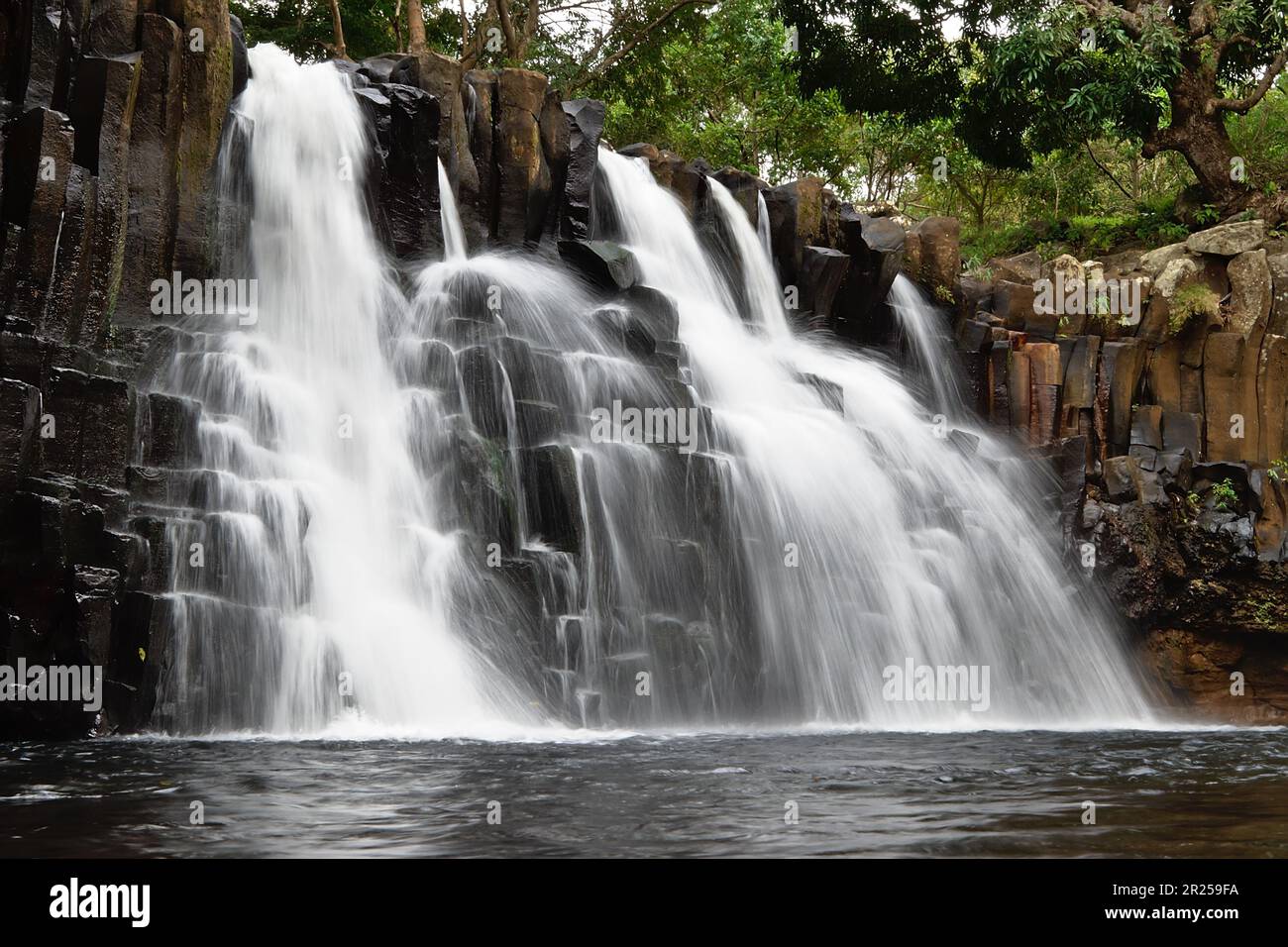 A beautiful waterfall amongst rocks. Nature background Stock Photo - Alamy