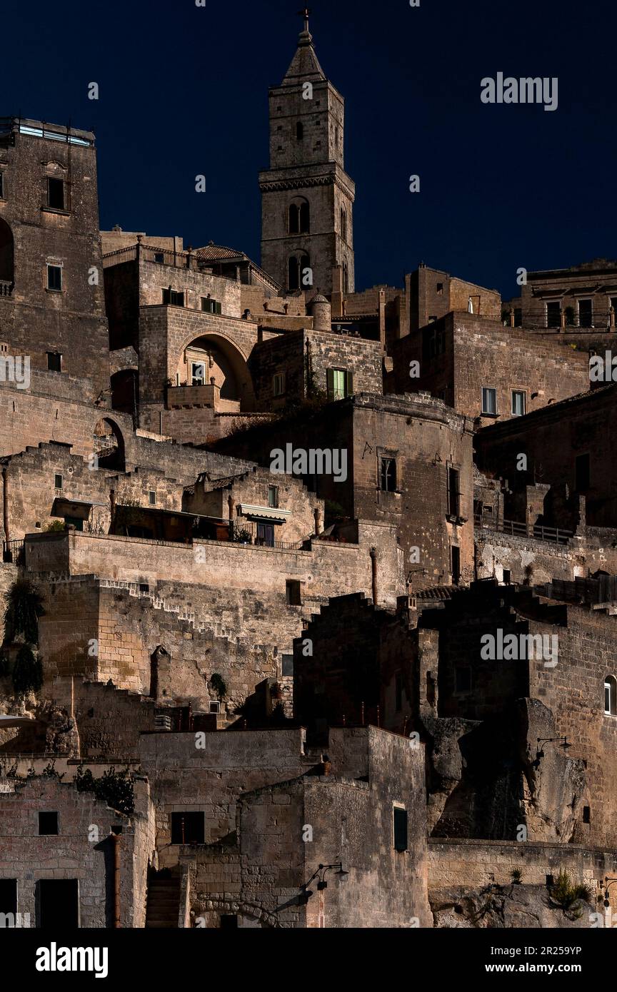 Matera, Basilicata, Italy, founded in about 250 BC, where cave dwellings were cut in two ‘underground cities’, together known as the Sassi di Matera, later joined by rock-hewn churches.  The Sassi have been regenerated by tourism and many cave dwellings have been sensitively converted into private homes and holiday apartments. Stock Photo