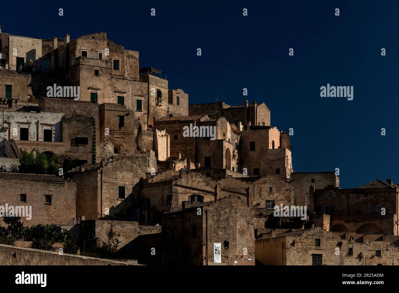 Matera, Basilicata, Italy, founded in about 250 BC, where troglodyte dwellings were cut in two ‘underground cities’, together known as the Sassi di Matera.  Today, the Sassi attract tourists and many cave dwellings have been enhanced, for example with the addition of new frontages, and are inhabited. Stock Photo