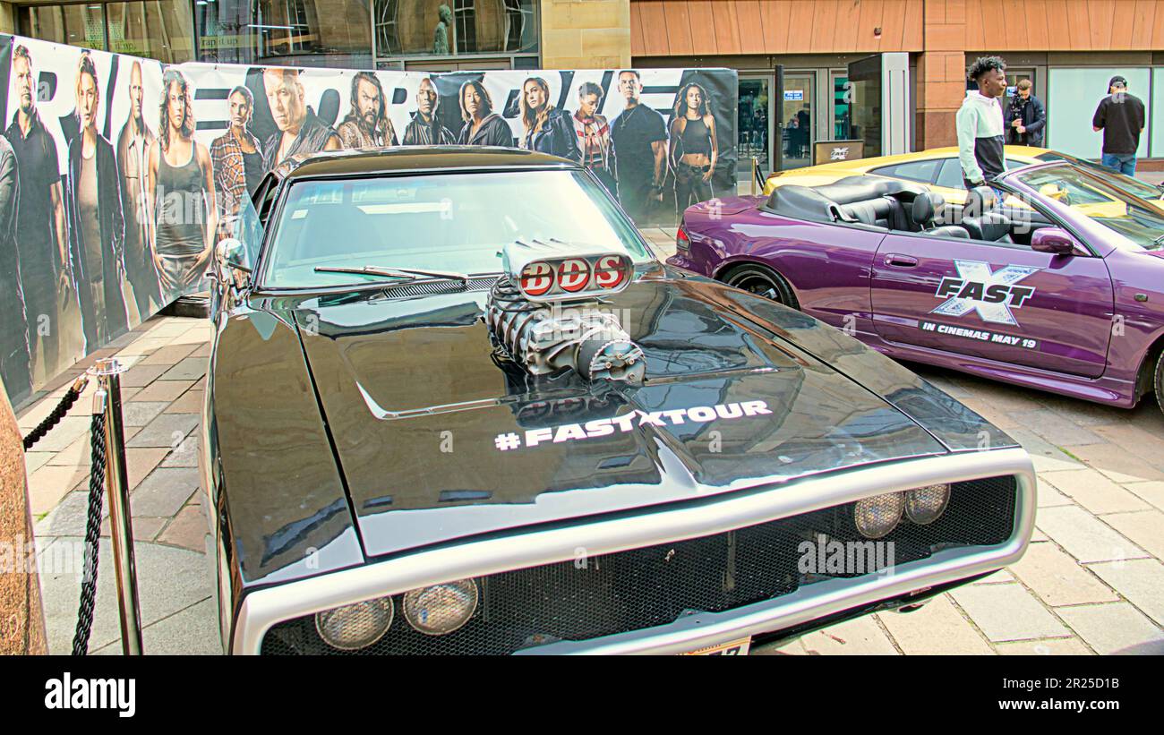 Glasgow, Scotland, UK 17th May, 2023. Fast and the furious franchise cars fastxtour visited the city used for some of its filming as girls and cars found their way to the concert hall steps on Buchanan street before reaching Birmingham tomorrow.. Credit Gerard Ferry/Alamy Live News Stock Photo