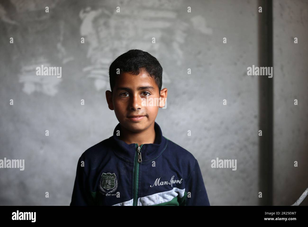 Portrait of a Palestinian boy. Palestinian children participate in activities aimed to support their mental health near the site of an Israeli airstrike in Deir Al-Balah in central Gaza Strip. This is following the recent fighting between Islamic Jihad militant group and Israel in Gaza. Palestine. Stock Photo
