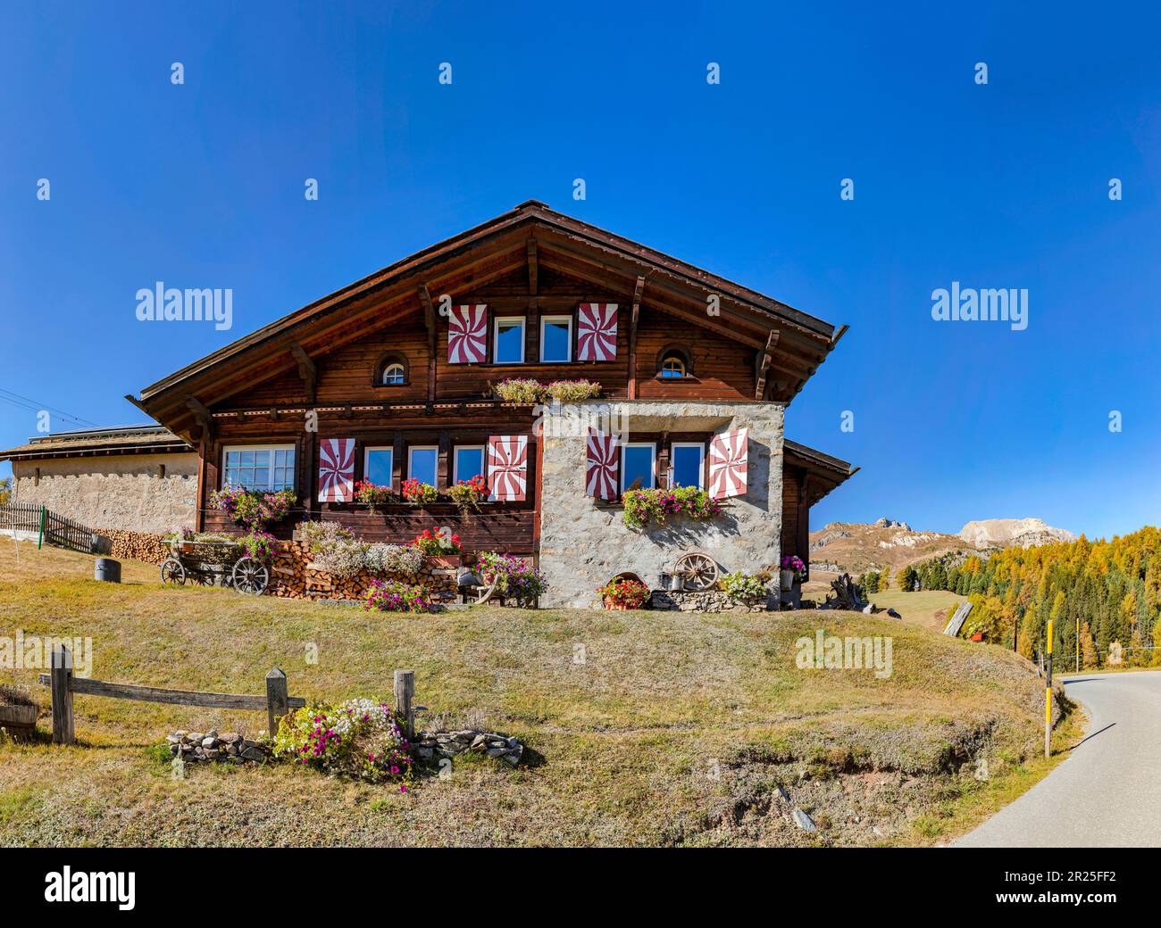 Traditional house with flower boxes at the Via Alpina *** Local Caption ...