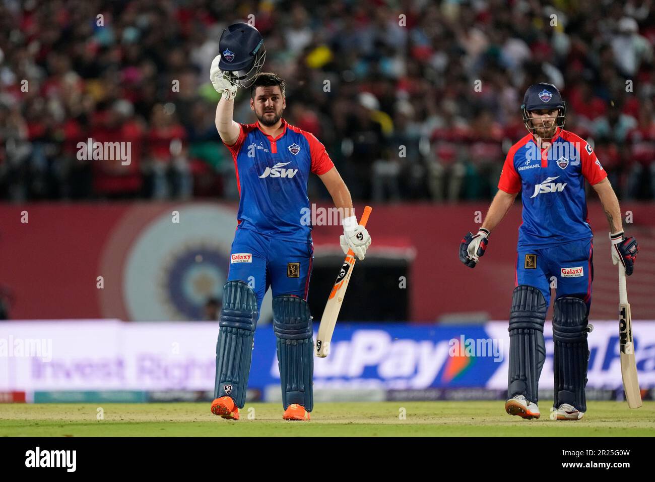 Delhi Capitals' Phil Salt, right, watches as batting partner Rilee