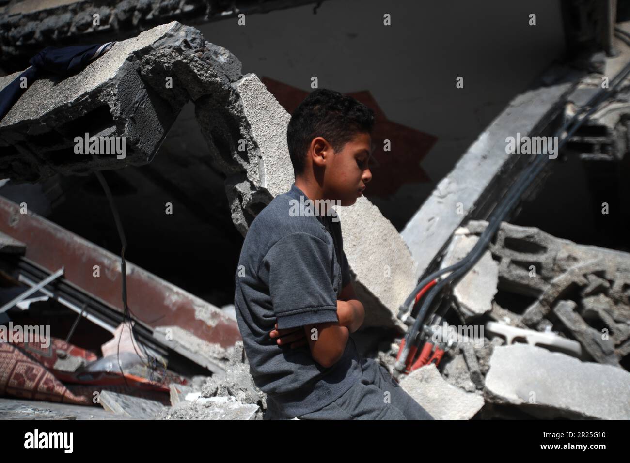 Portrait of a Palestinian boy. His house was destroyed in the Israeli airstrike in Deir Al-Balah in central Gaza Strip. This is following the recent fighting between Islamic Jihad militant group and Israel in Gaza. Palestine. Stock Photo