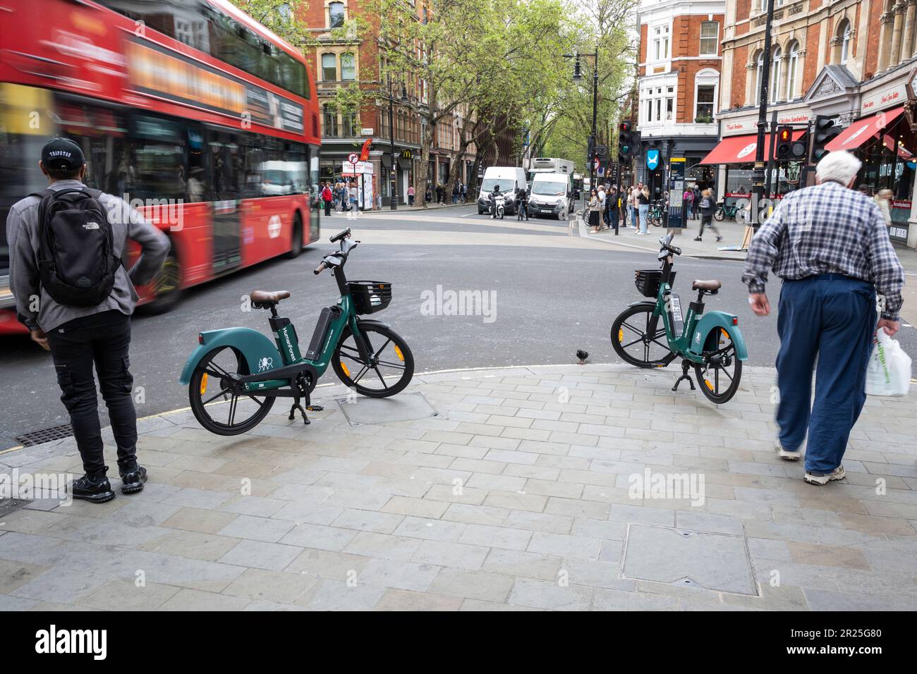 London, UK. 17 May 2023. The public passes electric hire cycles on a