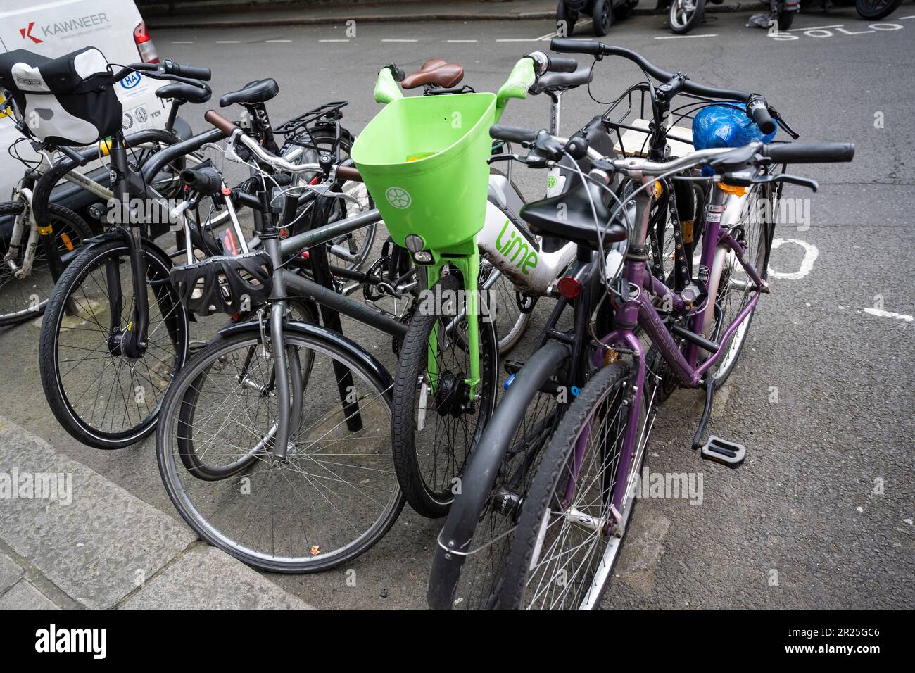 London, UK. 17 May 2023. An electric hire cycle amongst regular