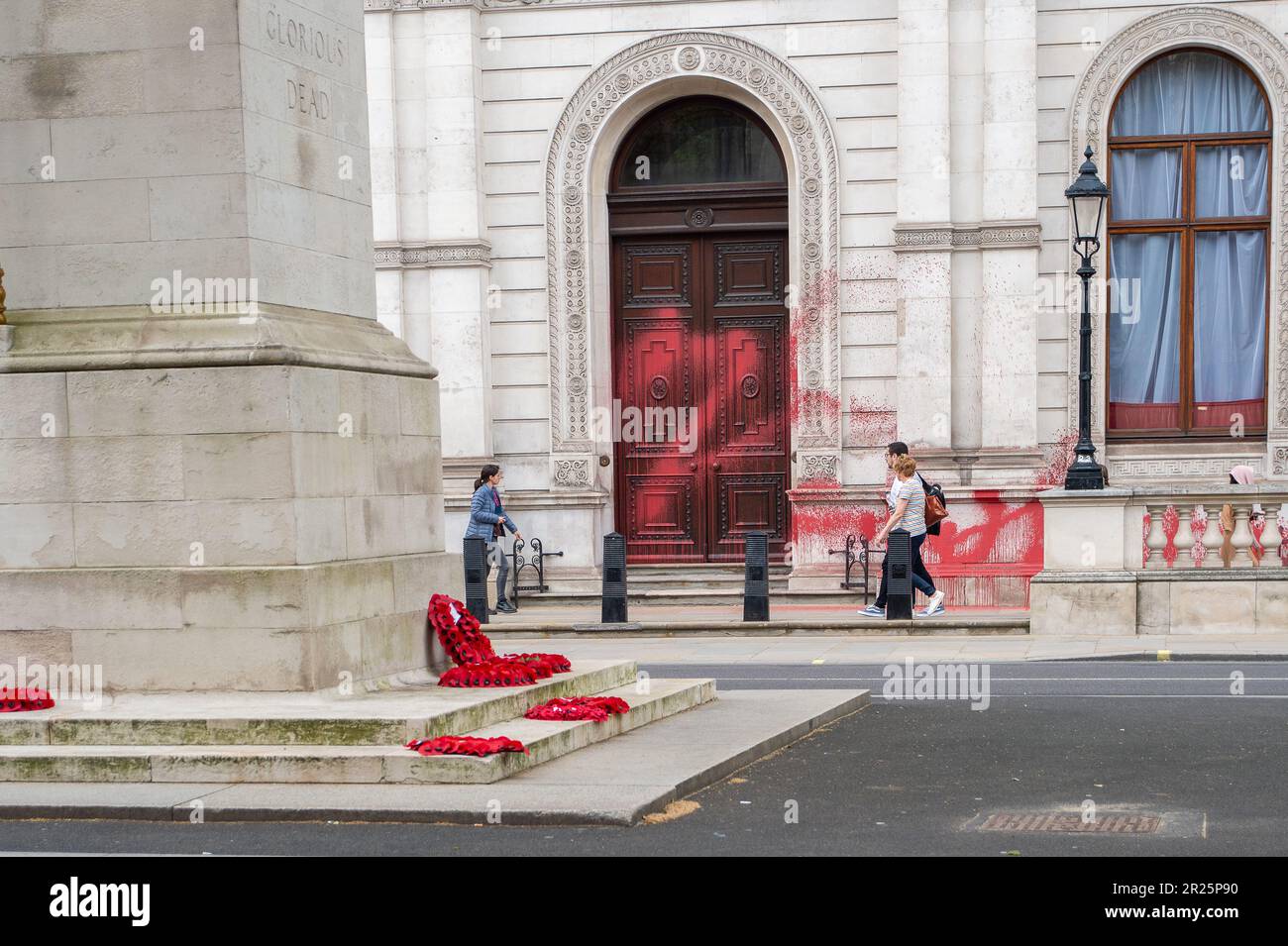 Whitehall, London, UK. 17th May, 2023. Palestine Action have tweeted on Monday 'Palestine Action sprayed Britain's Foreign Office with blood-red paint, to commemorate 75 years since the ethnic cleansing of Palestine began'. Two pro Palestine actionists were arrested for this Nakba 75 action opposite the Cenotaph in Whitehall by the Police. Bemused tourists were walking past the Foreign Office today looking at the aftermath of the red paint sprayed on this historic building. Credit: Alamy Live News Stock Photo