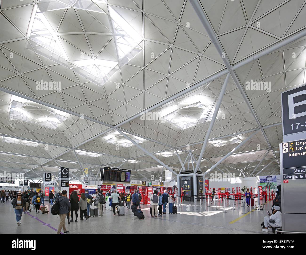 Interior view of Stansted Airport main terminal building showing distinctive roof structure. Designed by Norman Foster. Stock Photo
