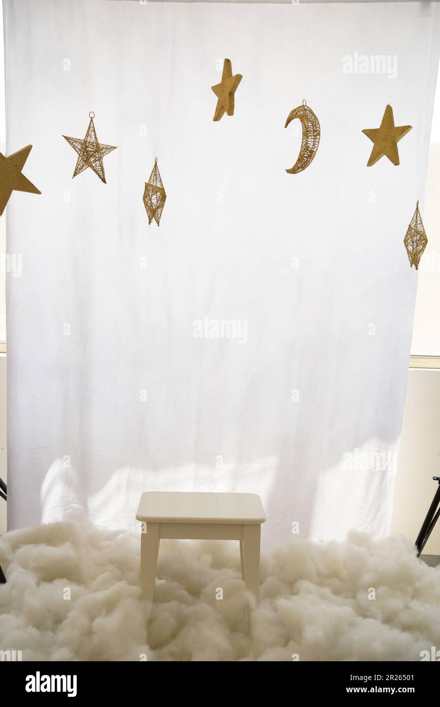 Kids studio background. Kids studio background theme moon and stars, night theme, Ramadhan theme chairs with clouds and stars. Kids' photography ideas Stock Photo