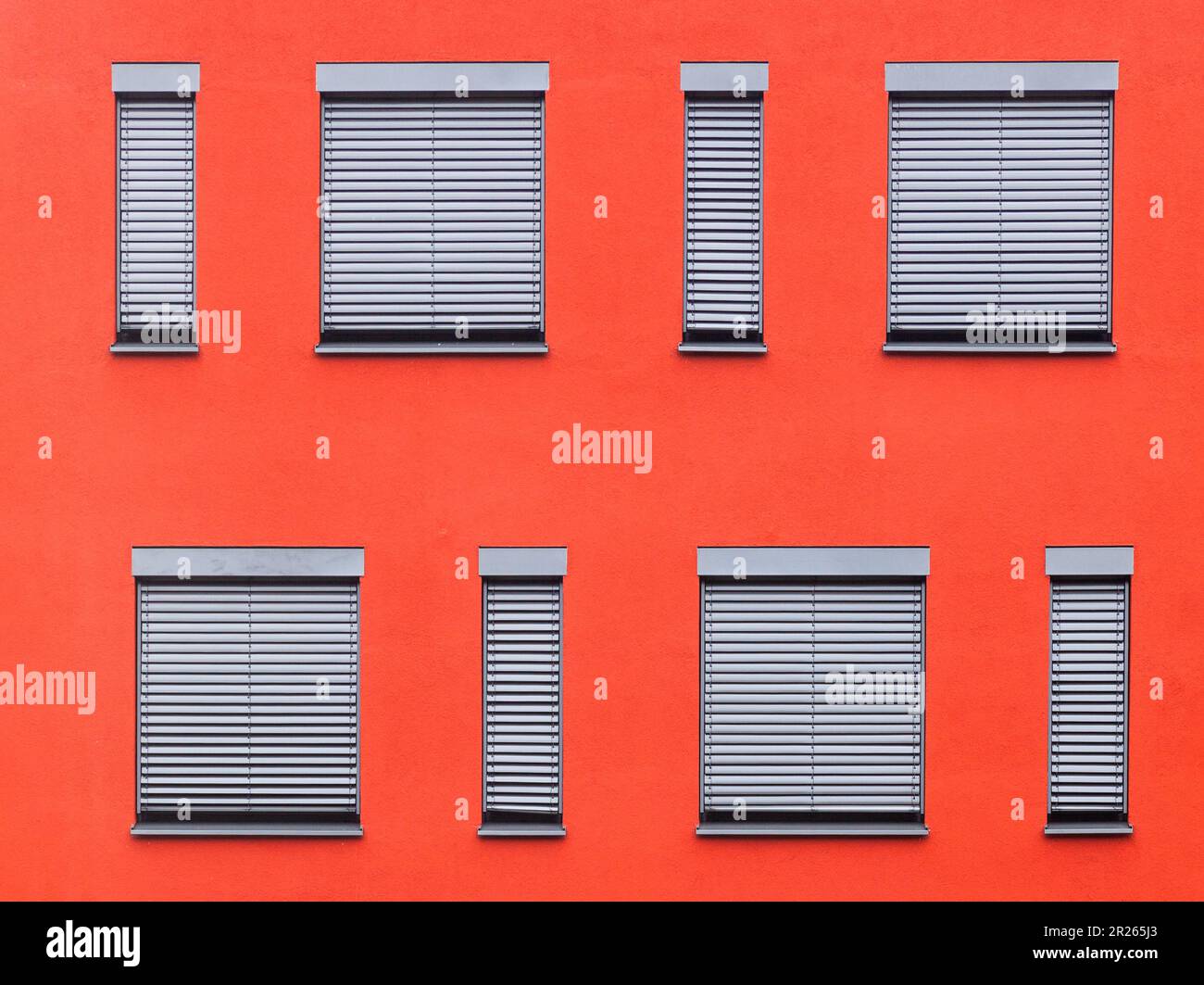 pattern of windows with red wall Stock Photo - Alamy