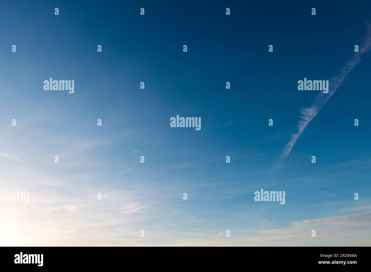 blue sky with light veil clouds - cirrostratus Stock Photo
