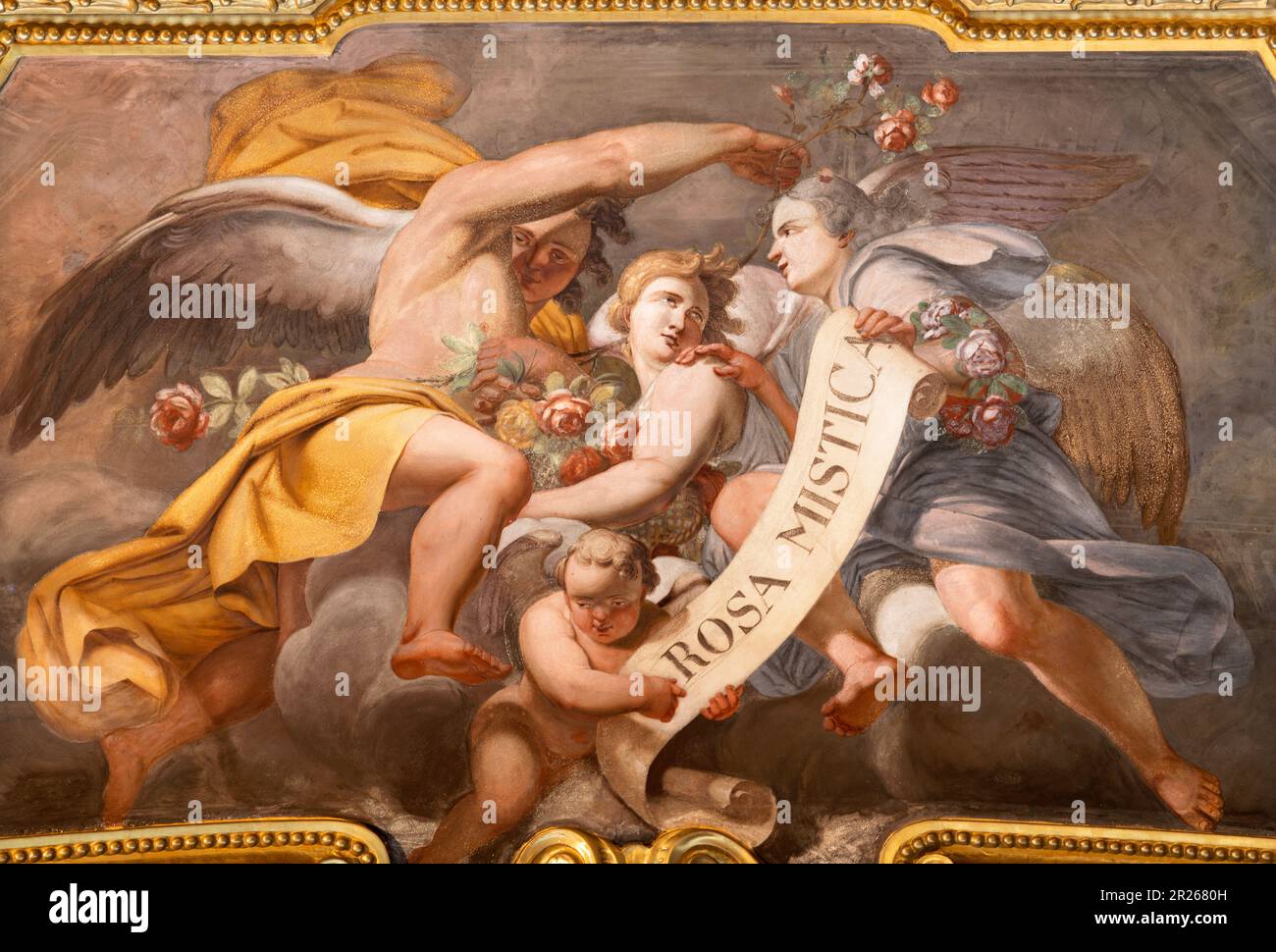 GENOVA, ITALY - MARCH 7, 2023: The baroque fresco of angels with the marianic inscipition in the church Basilica di Santa Maria delle Vigne Stock Photo