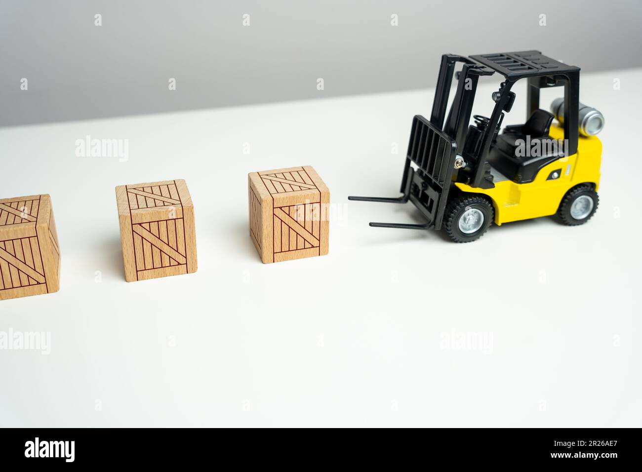 Wooden crates are picked up by a forklift. Preparation of order for shipment. Efficient process of preparing orders for shipment. It signifies the imp Stock Photo
