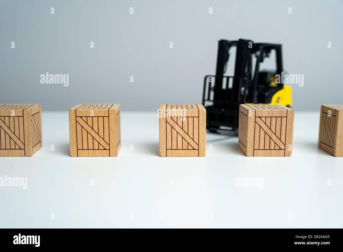 Wooden crates and forklift. Production and freight of goods. Transport department. Effective logistics and supply chain management in delivery of good Stock Photo
