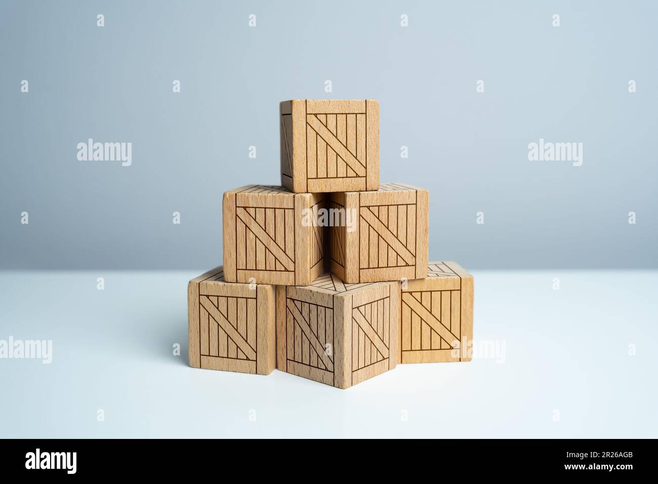 Stack of stacked wooden crates, pyramid of boxes. Order for shipment. Production and freight of goods. Increase in imports and exports, economic recov Stock Photo