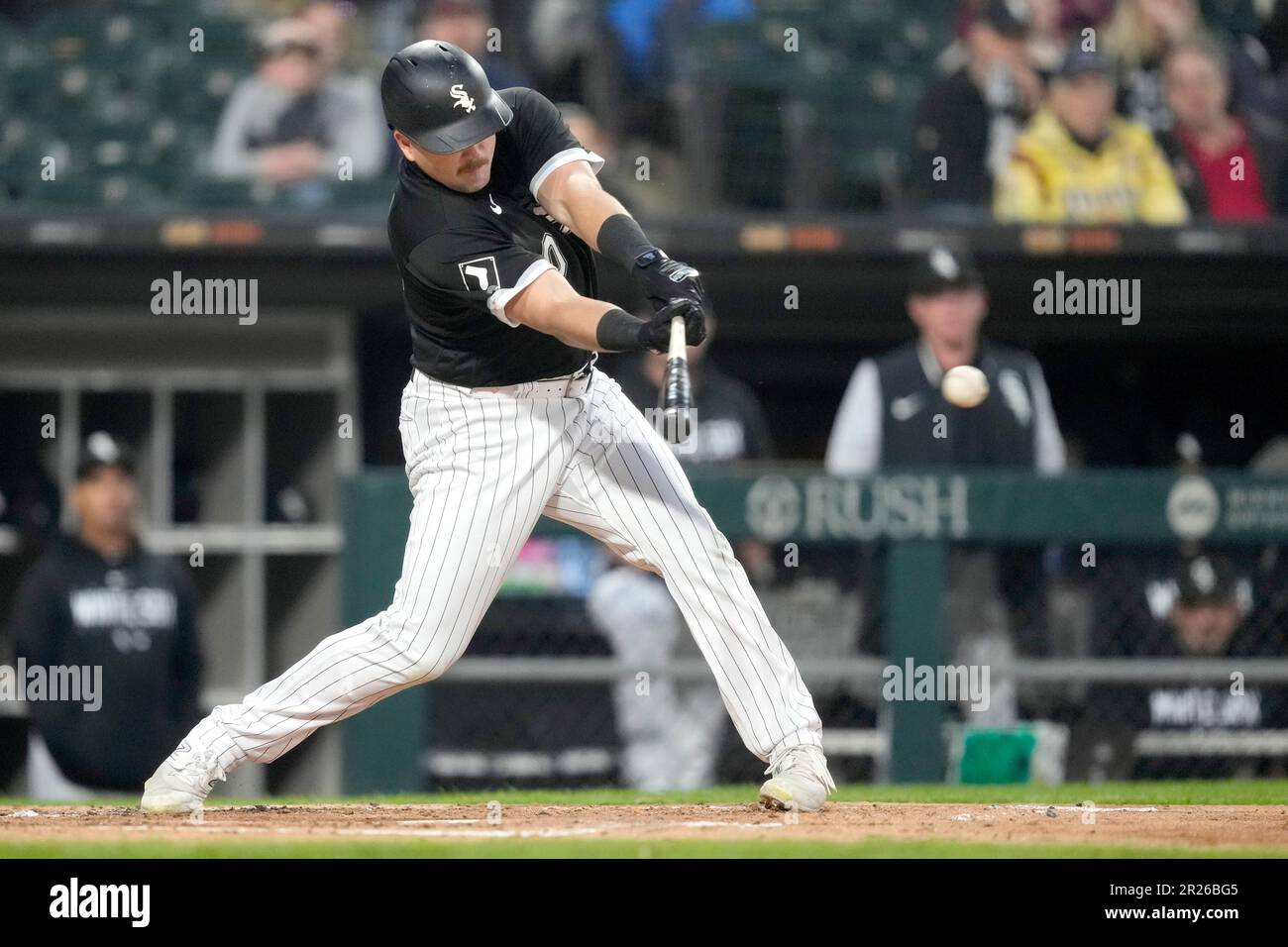Chicago White Sox's Jake Burger swings at a pitch in a baseball