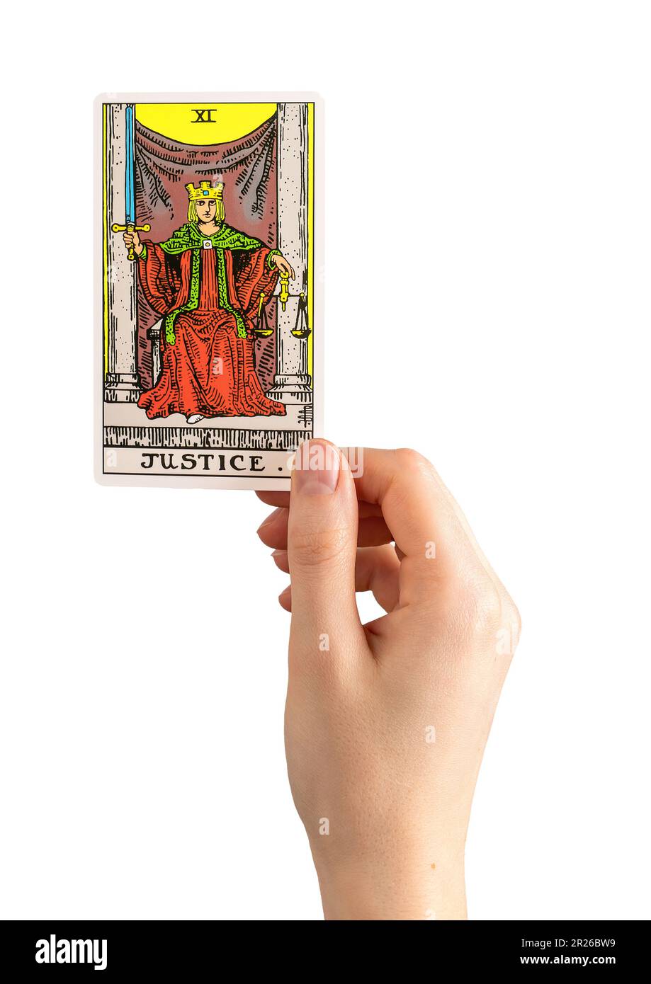 Berlin Germany May 16 2023 Hand holding tarot card Justice isolated on white background. Stock Photo