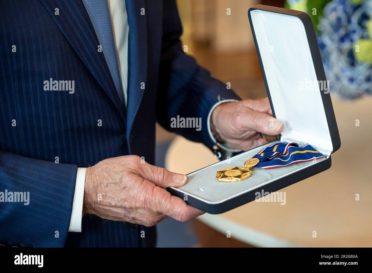 Washington, United States Of America. 17th May, 2023. Washington, United States of America. 17 May, 2023. U.S President Joe Biden holds the Public Safety Officer Medal of Valor during the presentation ceremony in the East Room of the White House, May 17, 2023 in Washington, DC The medal is the nations highest decoration for a Public Safety Officer for acts of bravery. Credit: Adam Schultz/White House Photo/Alamy Live News Stock Photo