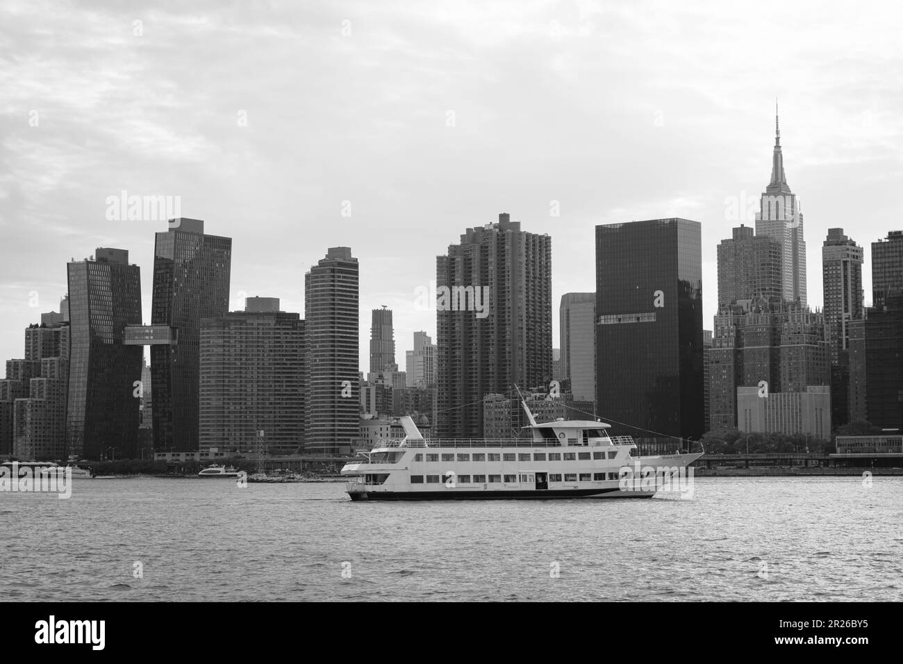 A ferry on the East River and view of the Manhattan skyline from Long Island City, Queens, New
