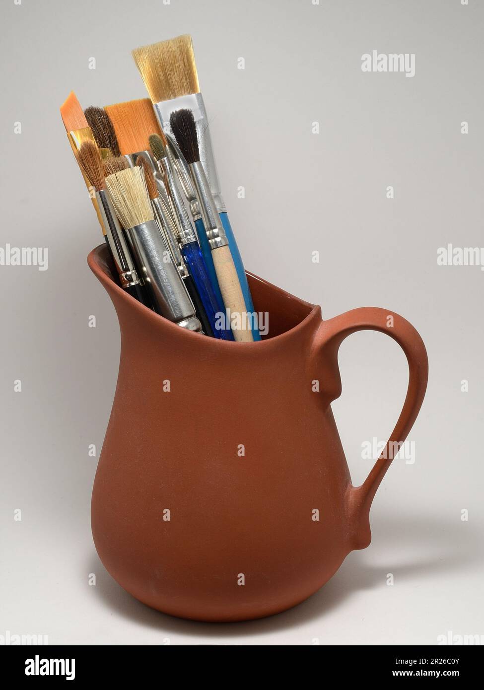 artistic brushes in a ceramic pot on a neutral background Stock Photo ...