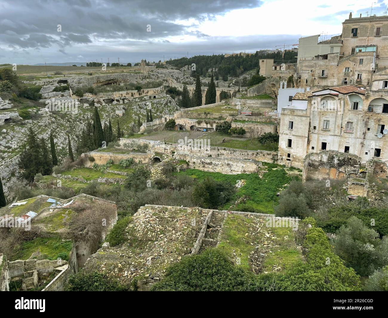 Gravina in Puglia, Italy. View over the ravine, with the archeological park on the left and the old town on the right. Stock Photo