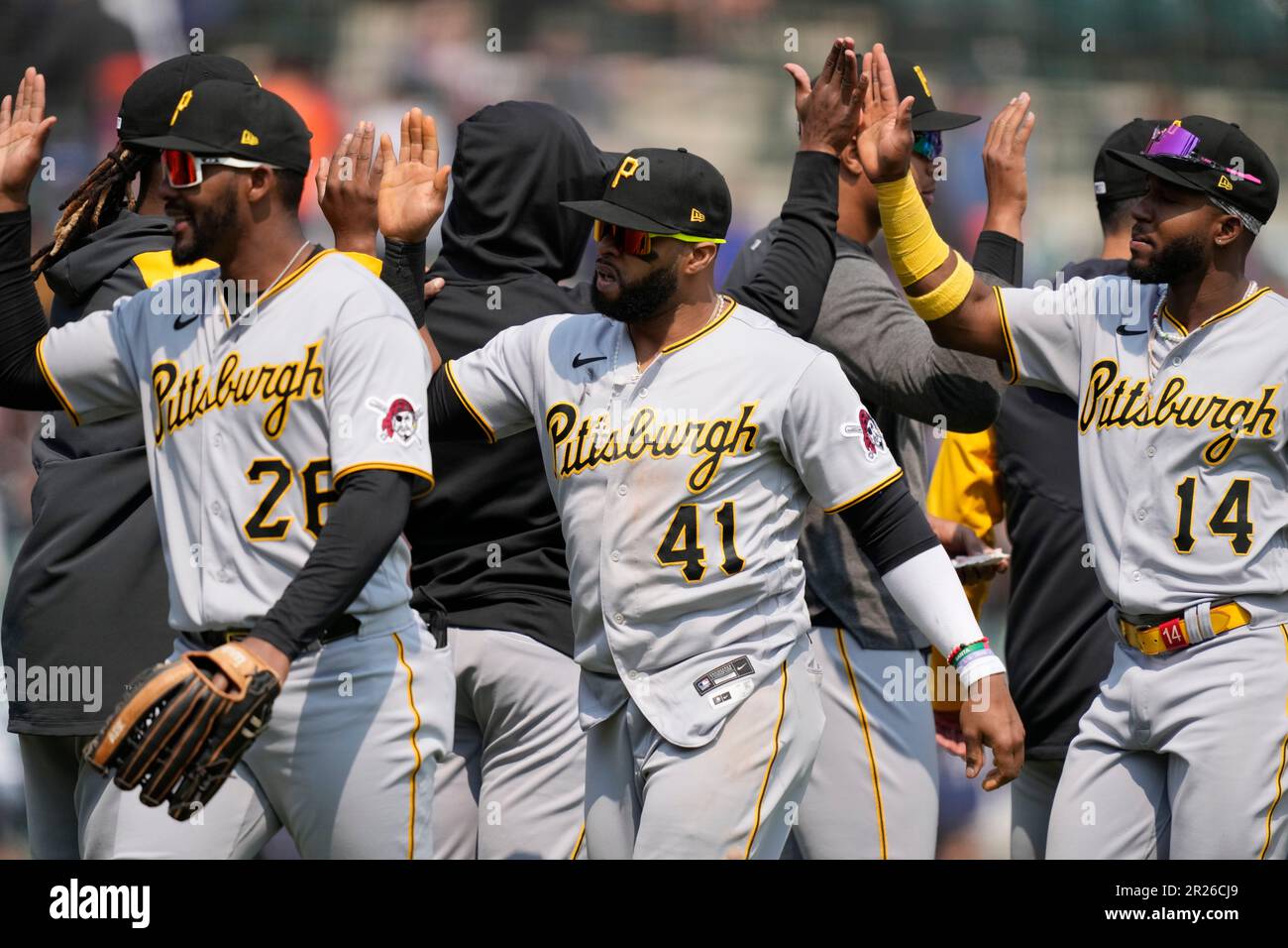 Pittsburgh Pirates left fielder Miguel Andujar (26), first baseman Carlos  Santana (41) and second baseman Rodolfo Castro (14) greet teammates after  the ninth inning of a baseball game against the Detroit Tigers