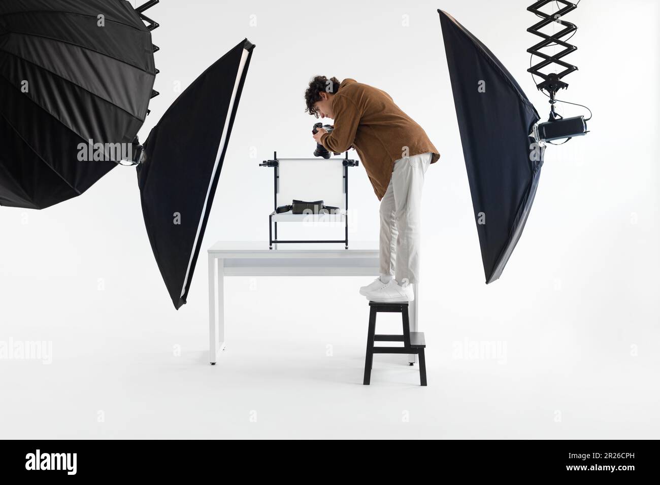 Capturing the artistic process. Full length shot of photographer guy ...