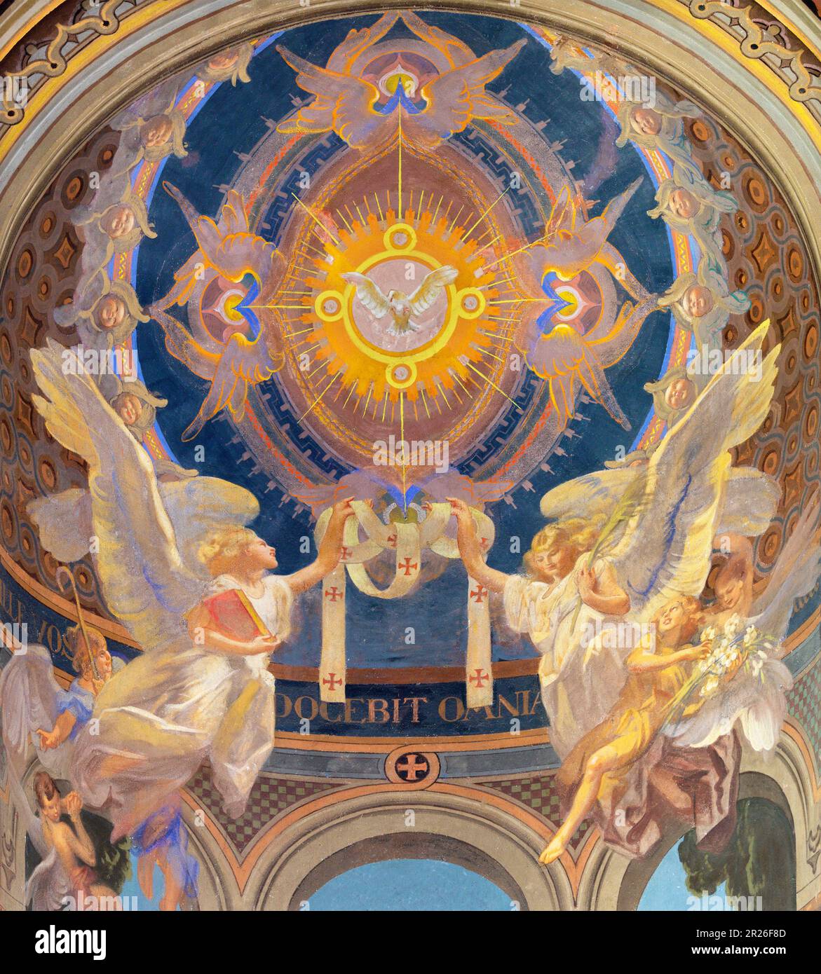 GENOVA, ITALY - MARCH 7, 2023: The fresco of Holy Spirit among the angels in the church Chiesa di Sacro Cuore e San Giacomo from 20. cent. Stock Photo