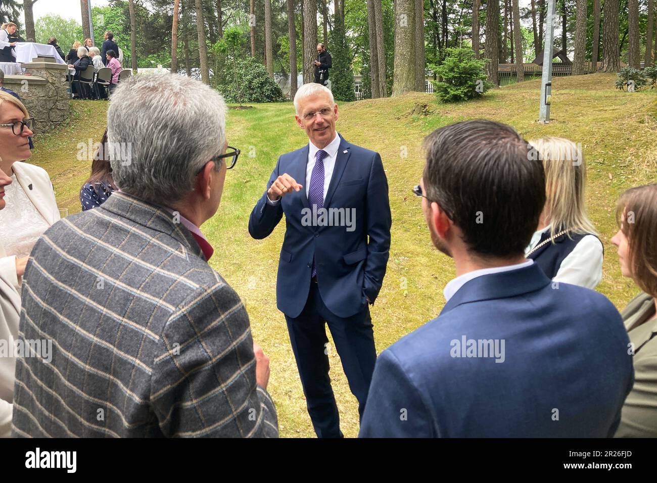 Riga, Latvia. 17th May, 2023. Krisjanis Karins (M), Prime Minister of Latvia, talking with other former graduates of the Latvian High School in Münster. Credit: Alexander Welscher/dpa/Alamy Live News Stock Photo